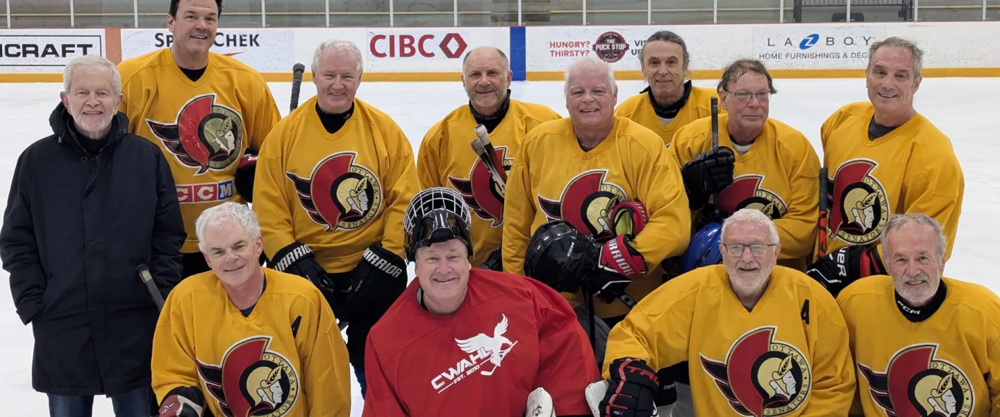 Ottawa Firebirds hockey team posing for a group photo on the ice