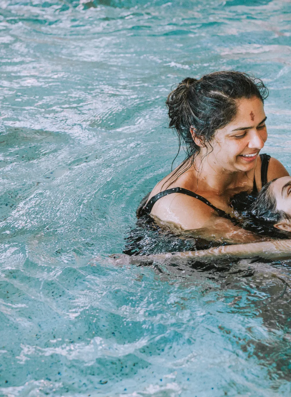 A mother and daughter in a swimming pool